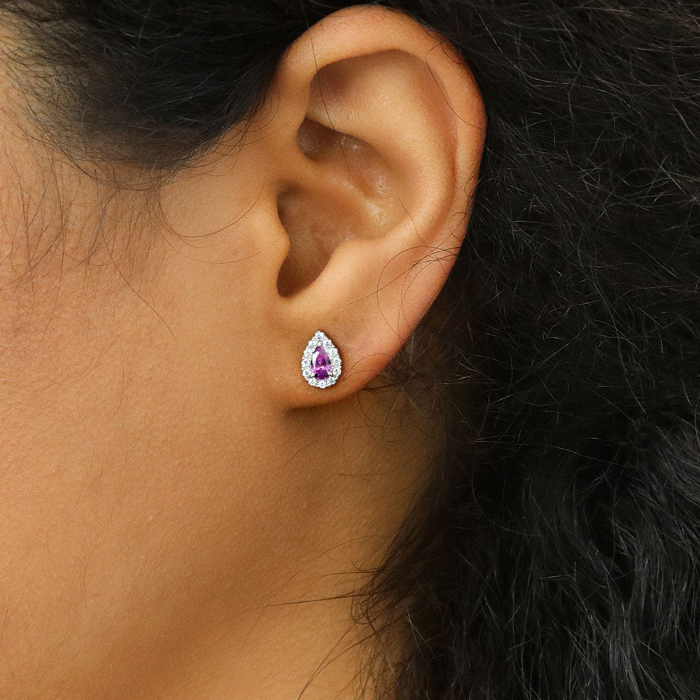 Model wearing Halo Pear CZ Stud Earrings in Sterling Silver