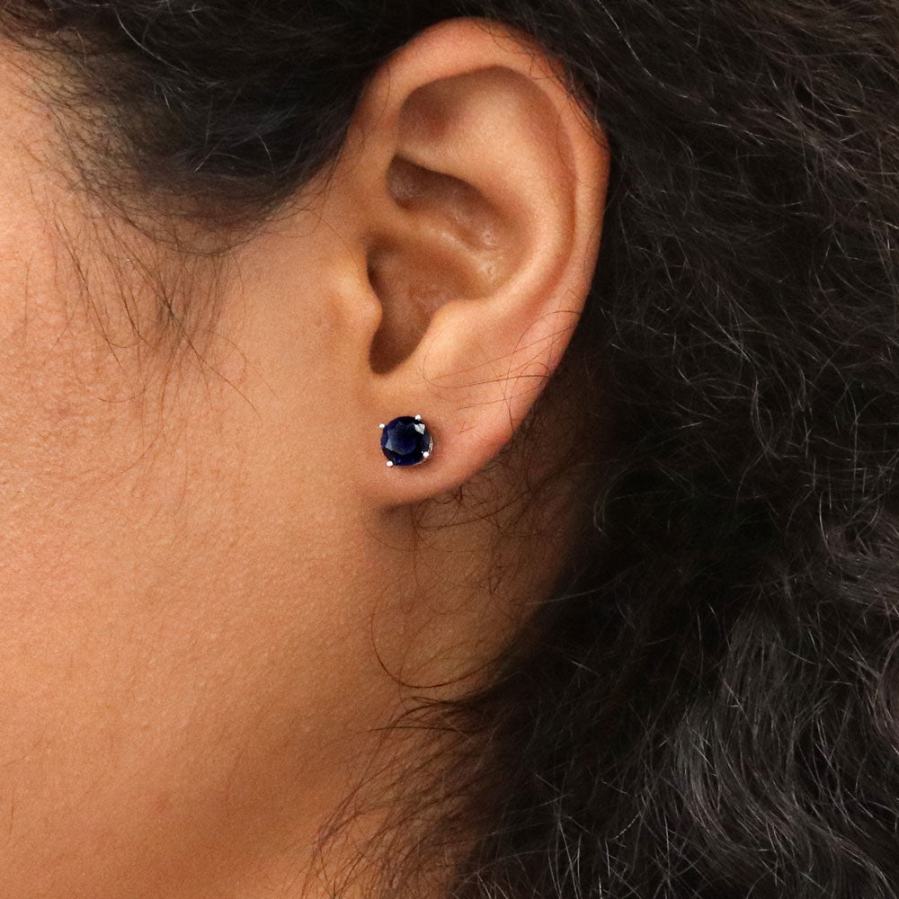 Model wearing Solitaire 1.6ct CZ Cartilage Stud Earrings in Sterling Silver, Sapphire Color