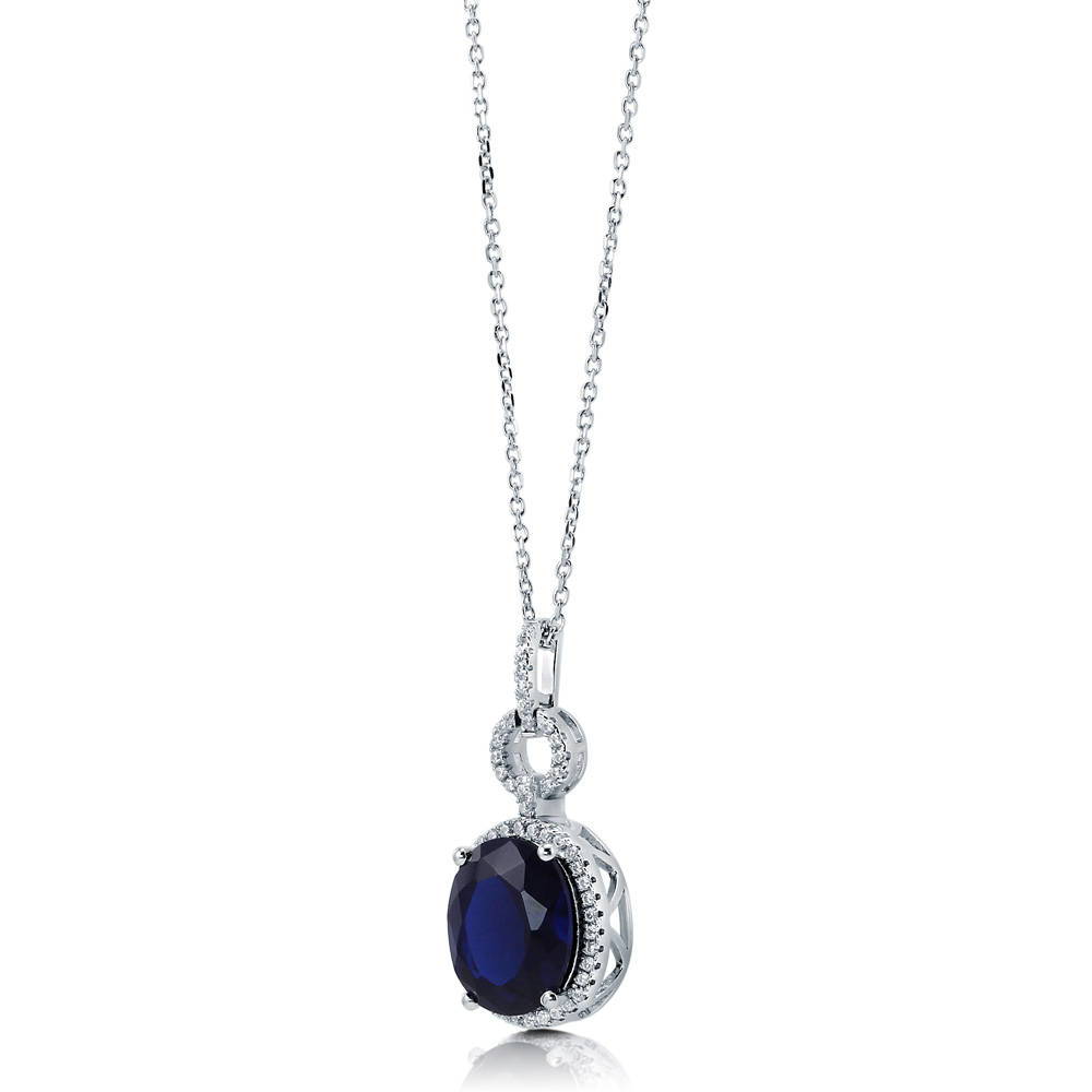Angle view of Halo Simulated Blue Sapphire Oval CZ Set in Sterling Silver