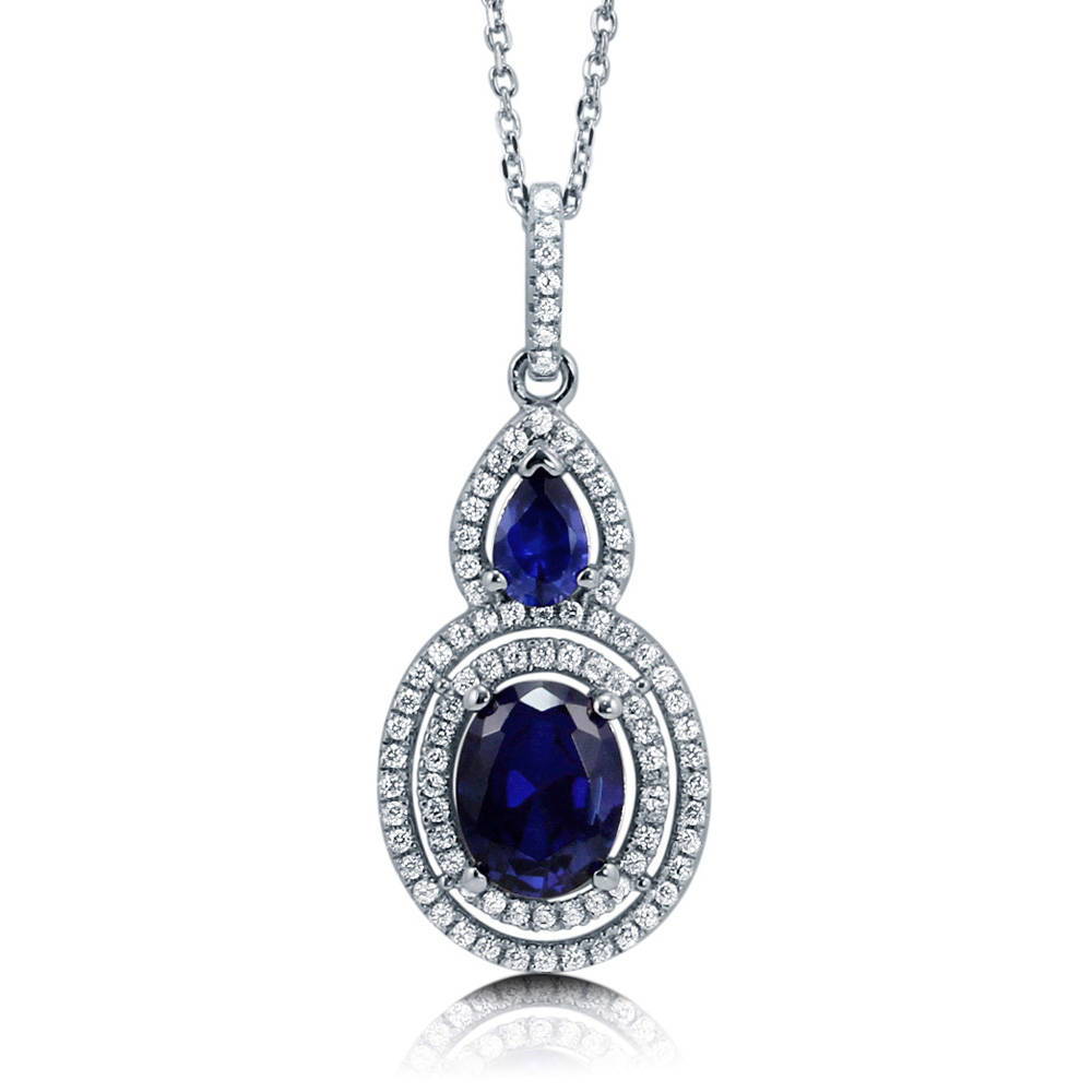 Halo Simulated Blue Sapphire Oval CZ Necklace in Sterling Silver