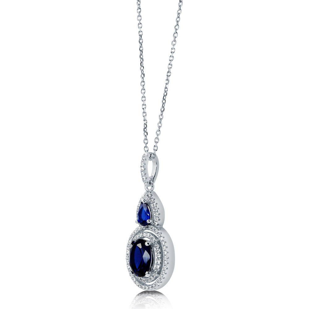 Angle view of Halo Simulated Blue Sapphire Oval CZ Set in Sterling Silver