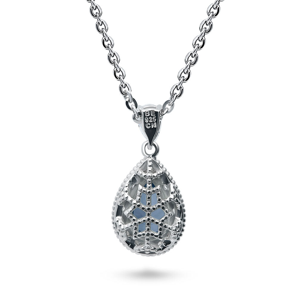 Angle view of Halo Blue Pear CZ Pendant Necklace in Sterling Silver