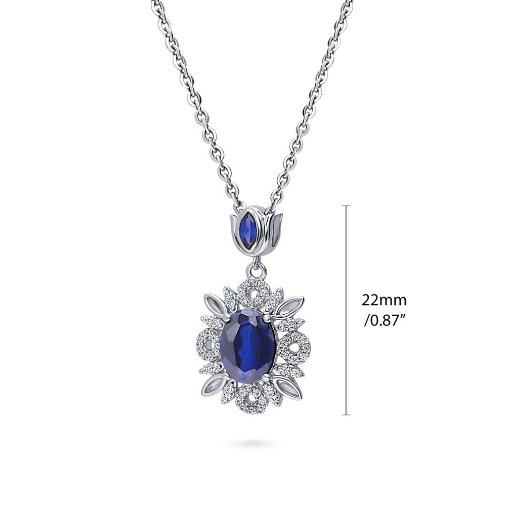 Front view of Flower Halo Simulated Blue Sapphire CZ Necklace in Sterling Silver