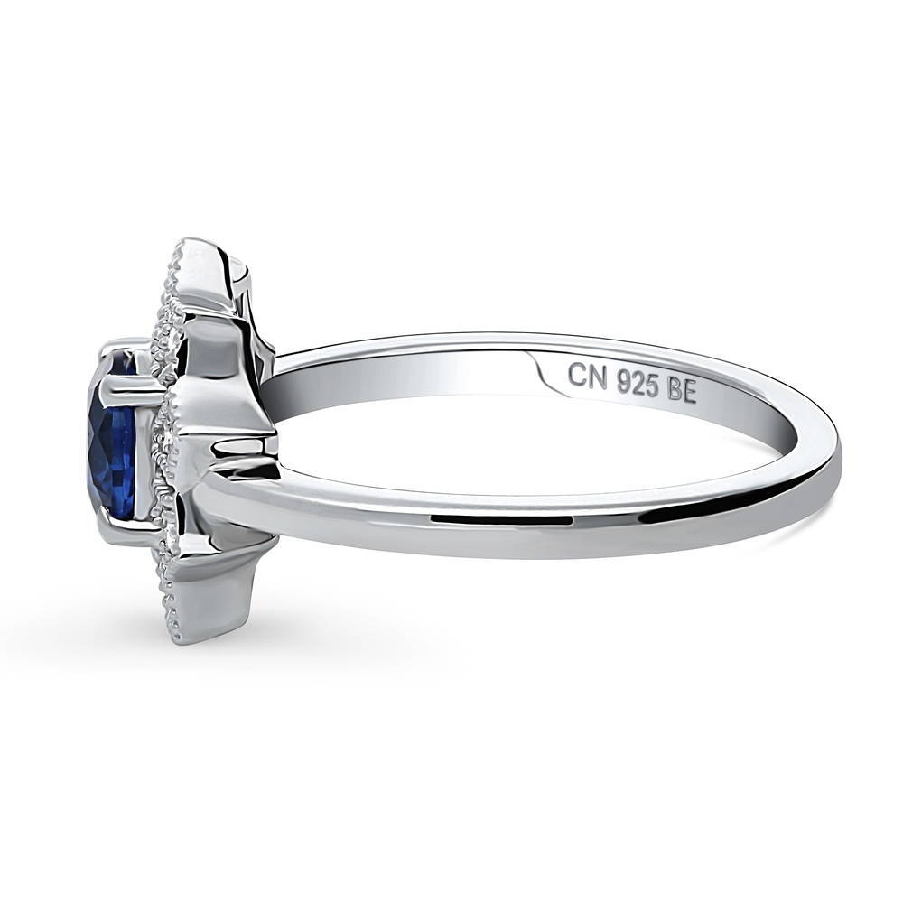 Angle view of Flower Halo Blue CZ Ring in Sterling Silver