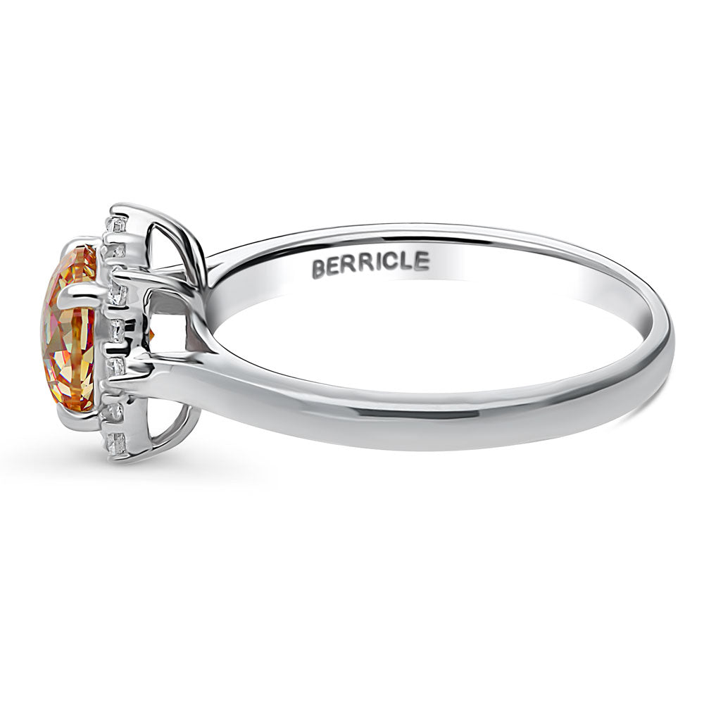 Angle view of Halo Sunburst Red Orange Round CZ Ring in Sterling Silver