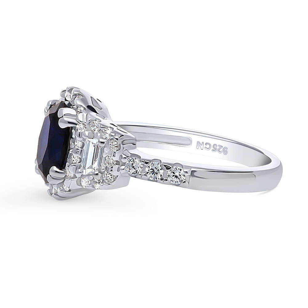 Angle view of 3-Stone Halo Simulated Blue Sapphire Oval CZ Ring in Sterling Silver
