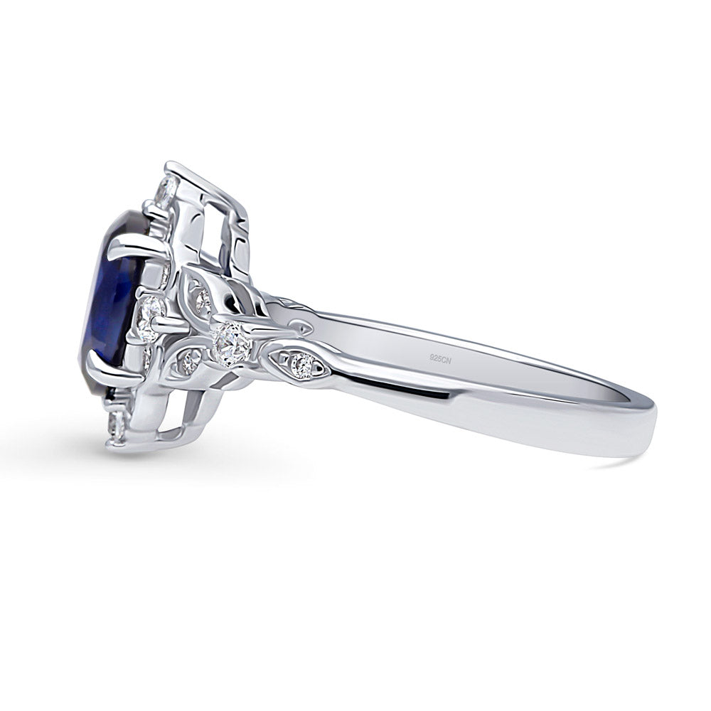 Angle view of Halo Art Deco Simulated Blue Sapphire Oval CZ Ring in Sterling Silver