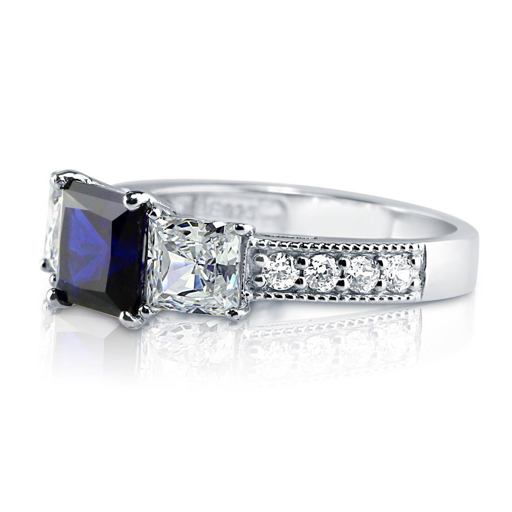Angle view of 3-Stone Simulated Blue Sapphire Princess CZ Ring in Sterling Silver