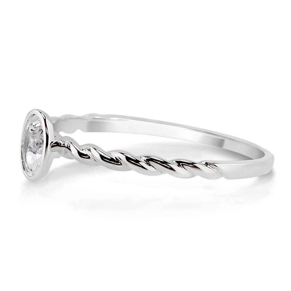 Angle view of Solitaire Cable Bezel Set Oval Topaz Ring in 10K White Gold