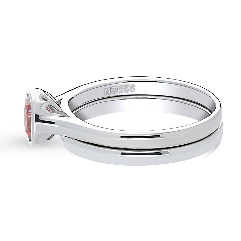 Angle view of Solitaire 0.8ct Red Bezel Set Round CZ Ring Set in Sterling Silver