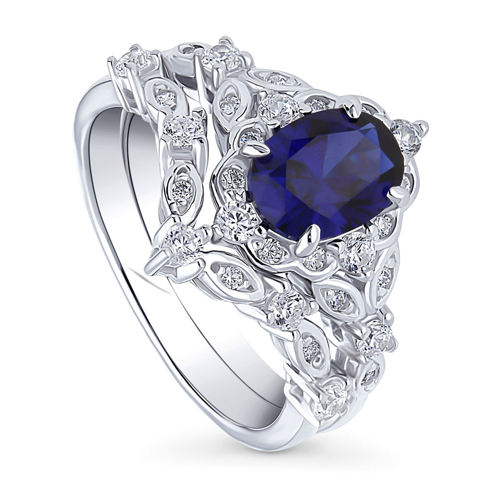 Front view of Chevron Halo Simulated Blue Sapphire CZ Ring Set in Sterling Silver