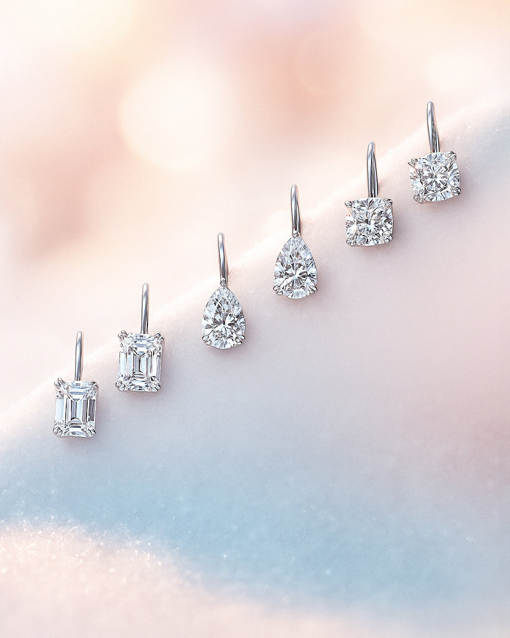 Solitaire leverback earrings on a soft, multicolored background