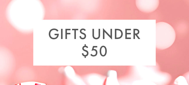 Promotional banner with 'Gifts Under $50' text on a pink background with blurred lights.