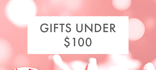 Promotional banner with 'Gifts Under $100' text on a pink background with blurred lights.