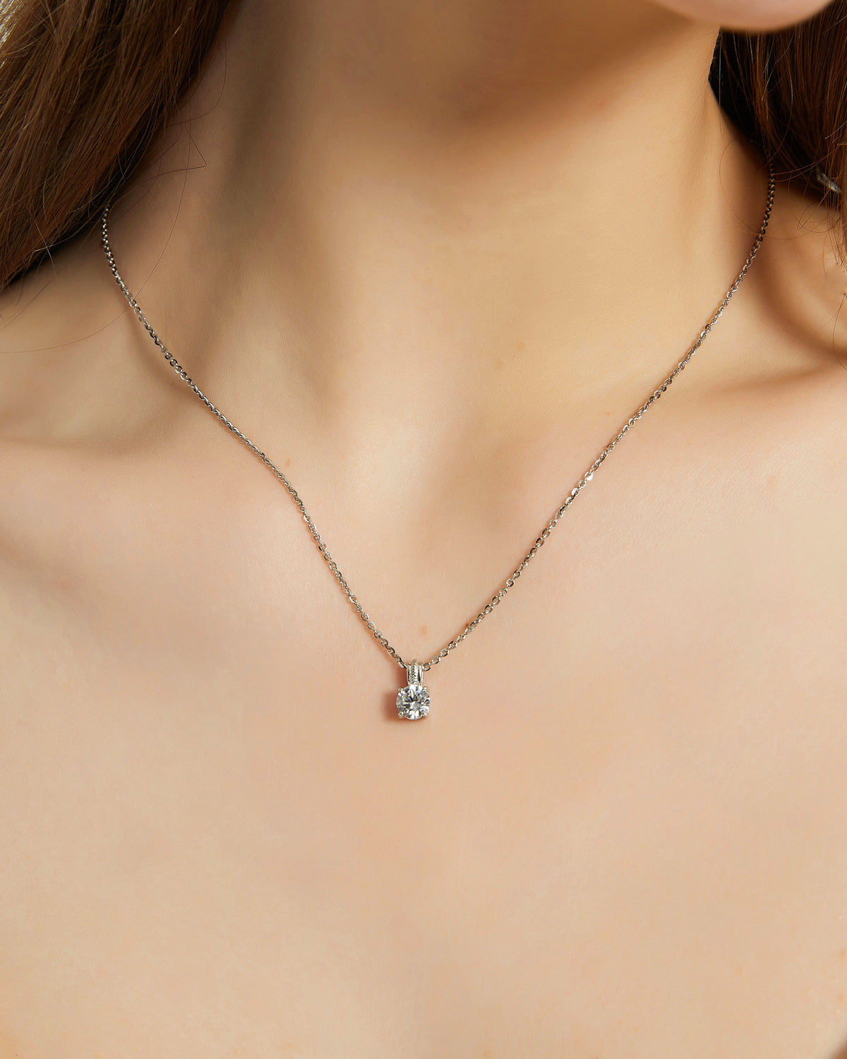 Necklace with a pendant on a person's neck
