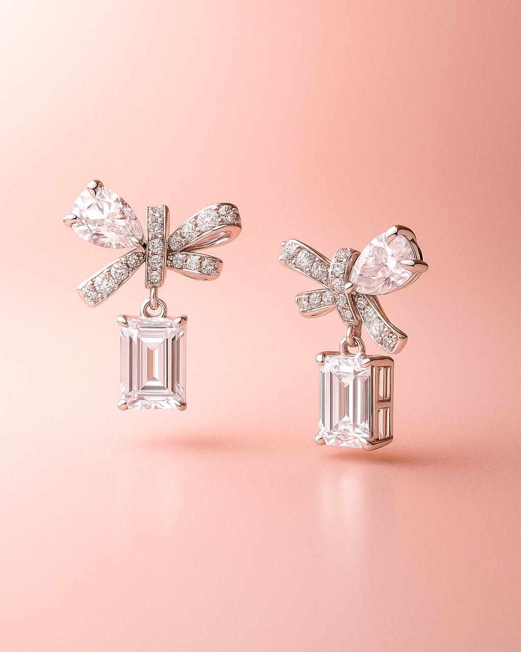 Earrings with bow design on a pink background