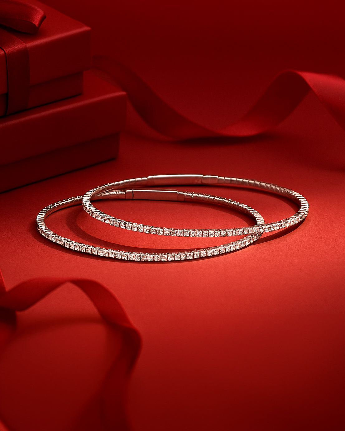 Silver bracelets on a red background