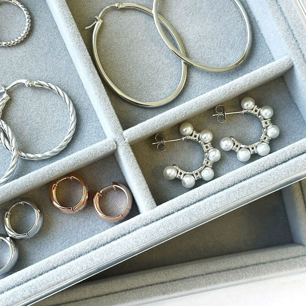 Flatlay view of Cable Hoop Earrings in Sterling Silver 1.2 inch, Yellow Gold Flashed