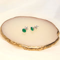 Flatlay view of Solitaire 1.6ct CZ Cartilage Stud Earrings in Sterling Silver, Emerald Color