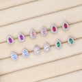 Flatlay view of Halo Pear CZ Stud Earrings in Sterling Silver