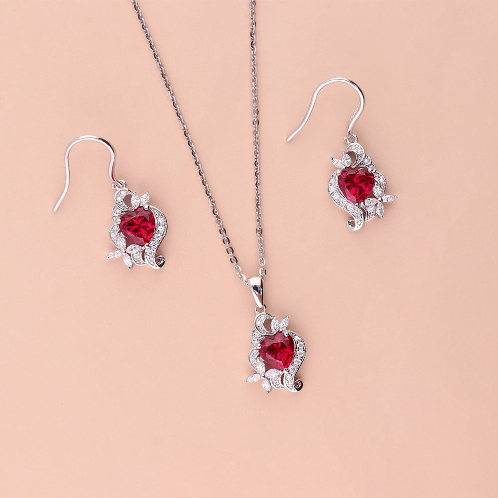 Flatlay view of Heart Flower CZ Fish Hook Earrings in Sterling Silver, Ruby Color