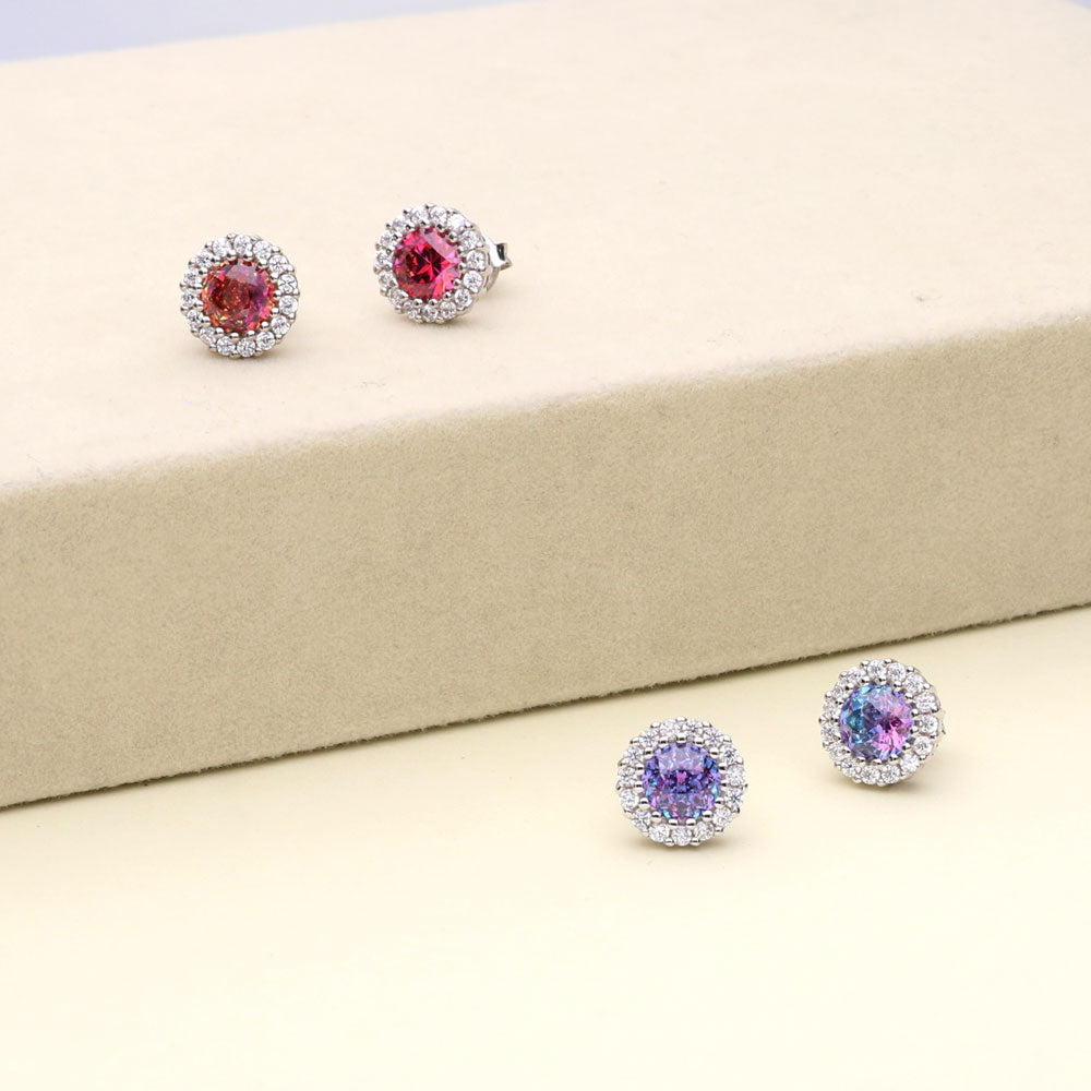 Flatlay view of Halo Kaleidoscope CZ Stud Earrings in Sterling Silver, Purple Aqua