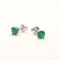 Flatlay view of Solitaire 1.6ct CZ Cartilage Stud Earrings in Sterling Silver, Emerald Color