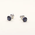 Flatlay view of Solitaire 1.6ct CZ Cartilage Stud Earrings in Sterling Silver, Sapphire Color