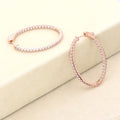 Flatlay view of Oval CZ Inside-Out Hoop Earrings in Sterling Silver 1.4 inch, Rose Gold Flashed