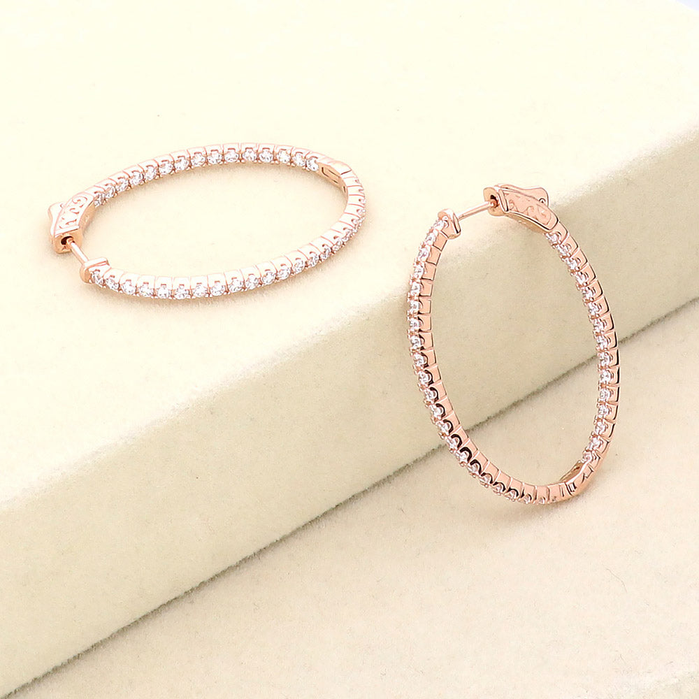 Flatlay view of Oval CZ Inside-Out Hoop Earrings in Sterling Silver 1.4 inch, Rose Gold Flashed