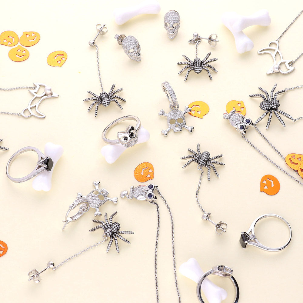 Flatlay view of Skull Bones CZ Earrings in Sterling Silver, 6 of 7