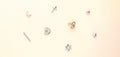 Flatlay view of Love Knot Stud Earrings in Sterling Silver, Yellow Gold Flashed