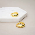 Flatlay view of Dome Small Hoop Earrings in Sterling Silver 0.8-1 inch, 2 Pairs, Yellow Gold Flashed