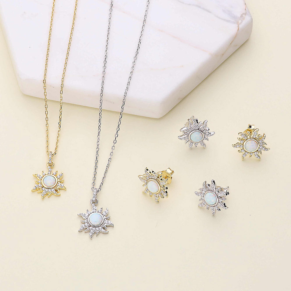 Flatlay view of Sun Sunburst Halo Opal-White CZ Stud Earrings in Sterling Silver