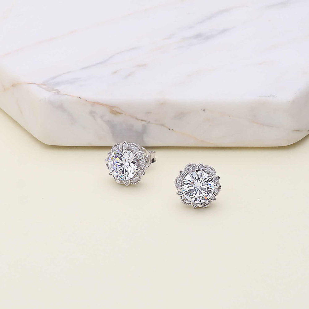 Flatlay view of Flower Halo CZ Necklace and Earrings in Sterling Silver, 11 of 15