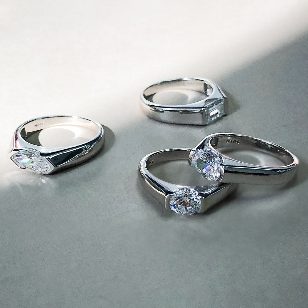 Flatlay view of Solitaire East-West 1.2ct Bezel Oval CZ Ring in Sterling Silver, 9 of 10
