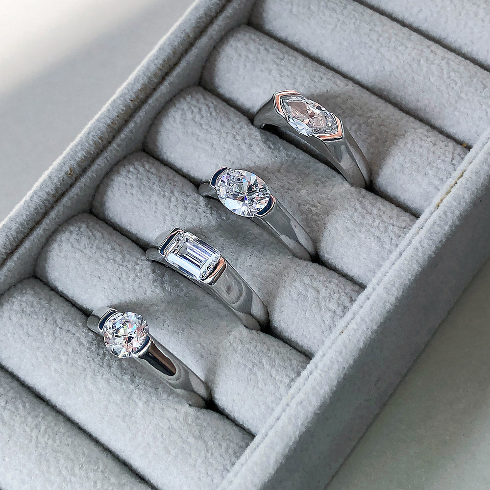 Flatlay view of Solitaire East-West 1.2ct Bezel Oval CZ Ring in Sterling Silver, 7 of 10