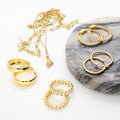 Flatlay view of Cable Small Hoop Earrings in Sterling Silver 0.9 inch, Yellow Gold Flashed