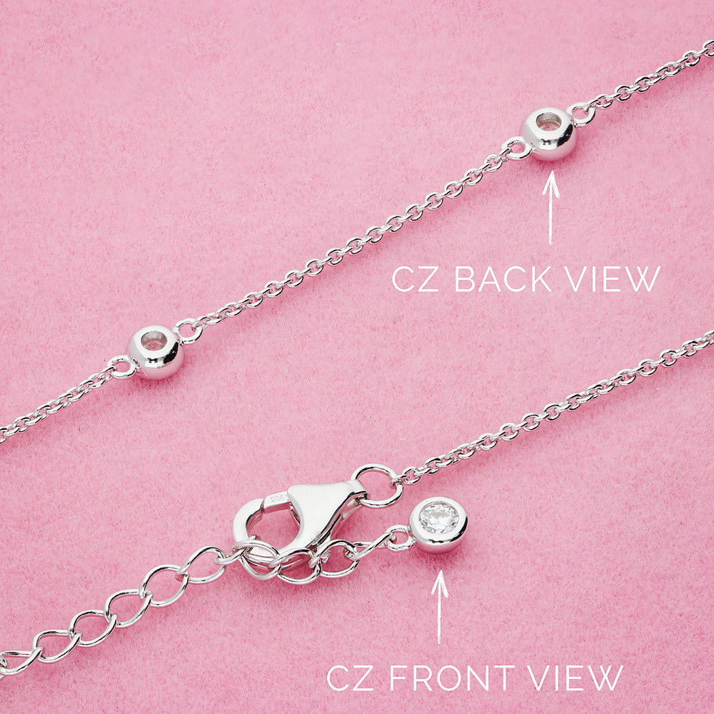 Flatlay view of Station CZ Station Necklace in Sterling Silver, Yellow Gold Flashed / 16 inch + 2 inch extension