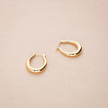 Flatlay view of Oval Small Hoop Earrings 0.9 inch, Gold-Tone