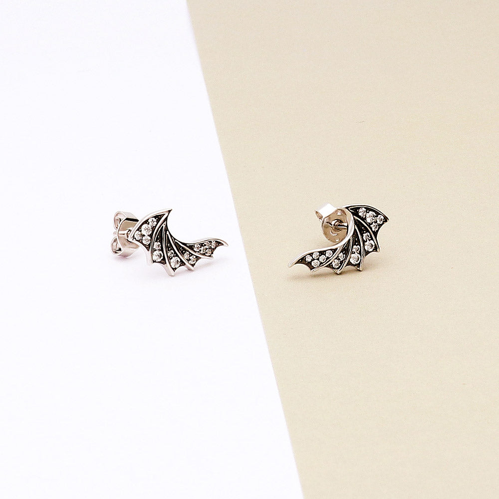 Flatlay view of Bat Wings CZ Stud Earrings in Sterling Silver, 2 of 5