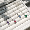 Flatlay view of Solitaire 1ct Pear CZ Necklace in Sterling Silver