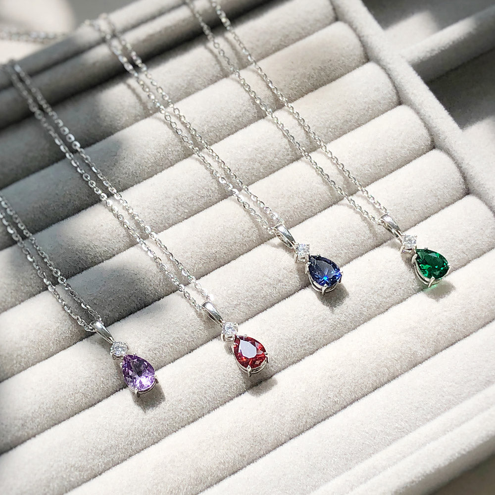 Flatlay view of Solitaire 1ct Pear CZ Necklace in Sterling Silver