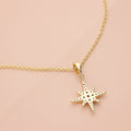 Flatlay view of North Star CZ Necklace in Sterling Silver, Yellow Gold Flashed