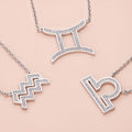 Flatlay view of Zodiac CZ Pendant Necklace in Sterling Silver, Aquarius