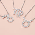 Flatlay view of Zodiac CZ Pendant Necklace in Sterling Silver, Capricorn
