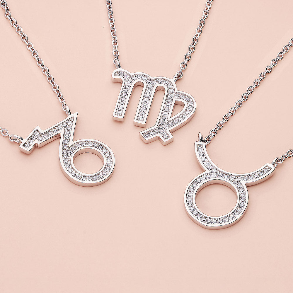 Flatlay view of Zodiac CZ Pendant Necklace in Sterling Silver, Capricorn