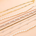 Flatlay view of Station CZ Station Necklace in Sterling Silver, Rhodium Plated / 16 inch + 2 inch extension