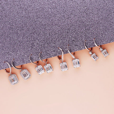 Halo Dangle Earrings Style E1224-01, Solitaire Dangle Earrings Style E1434-01 in Flatlay Display