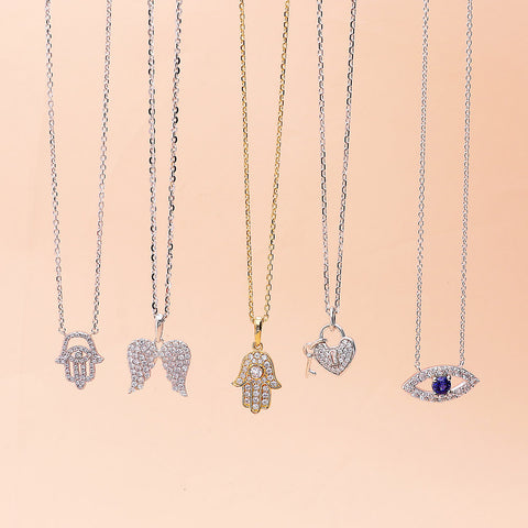 Evil Eye Necklace Style N1365-01, Key and Lock Necklace Style N1441-01 in Flatlay Display